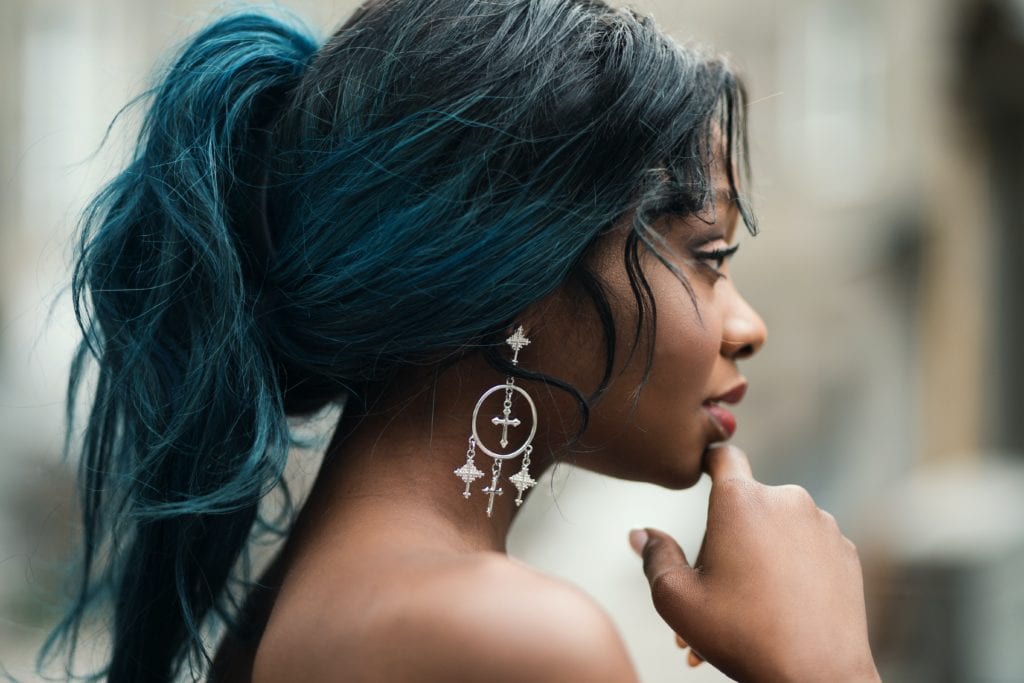 side profile of girl with blue ombre ponytail